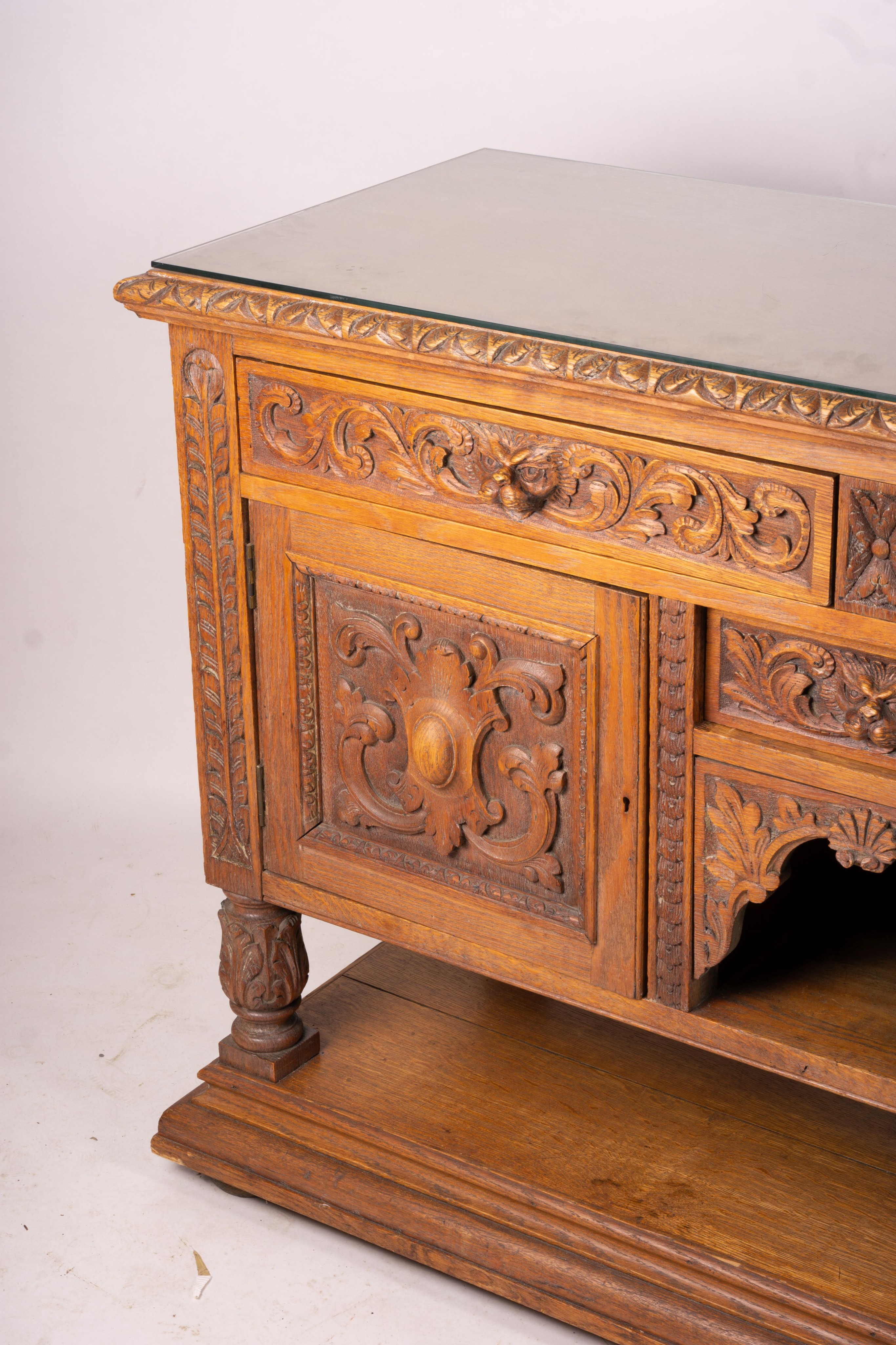 A late 19th century Flemish carved oak buffet, length 158cm, depth 58cm, height 99cm